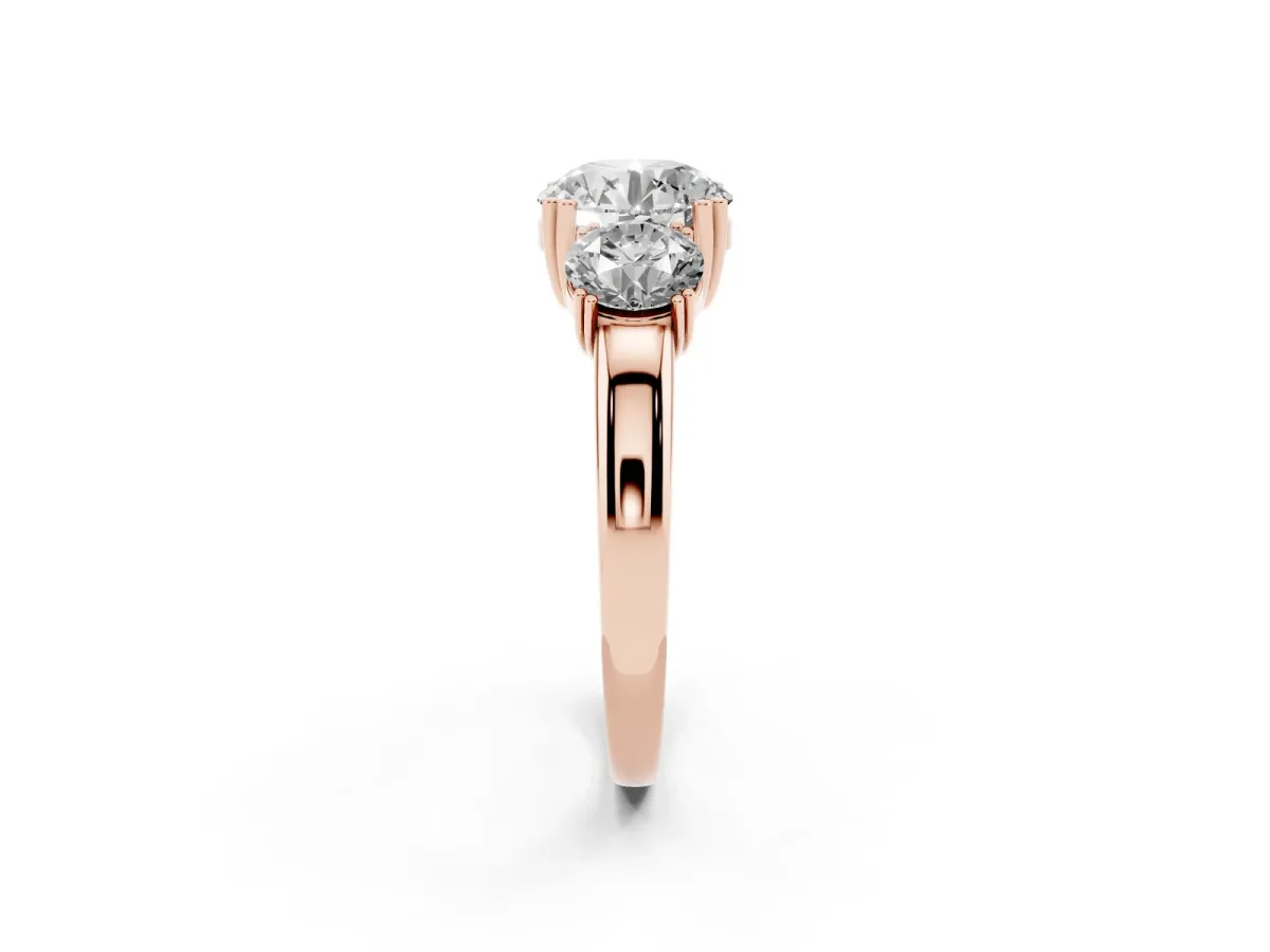 Three-Stone Round Cut Cut Diamond Ring with Channel Set Band and Four-Prong Setting Rose gold
