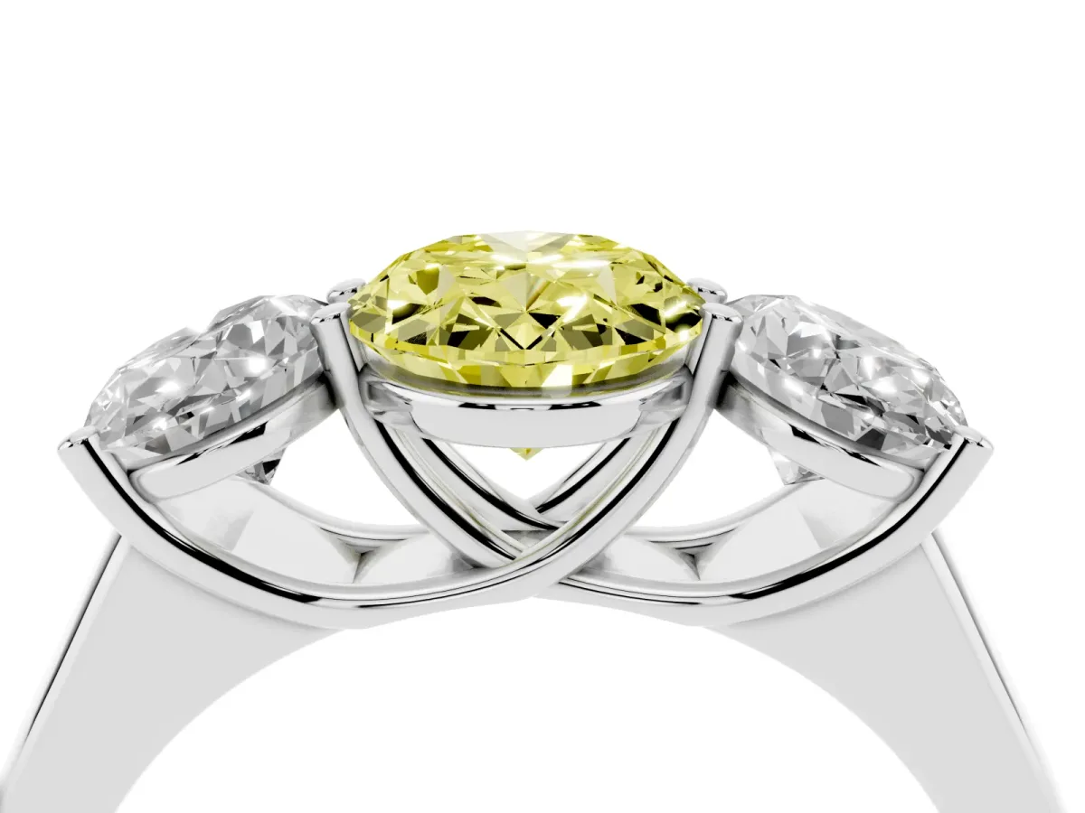 Fancy Yellow Oval Cut Three-Stone Diamond Ring with Prong Setting on a Classic Band Platinum