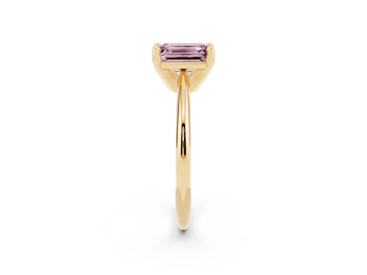 Fancy Pink Emerald Cut Cut Solitaire Ring with Four-Prong Setting on a Classic Band Yellow gold