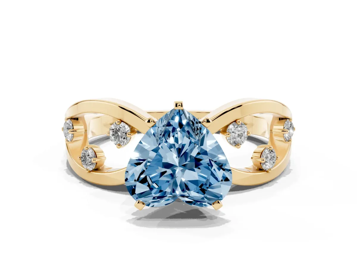 Fancy Blue Heart Cut Cut Solitaire Diamond with Side Stones on Criss-Cross Band and Four-Prong Setting Yellow gold