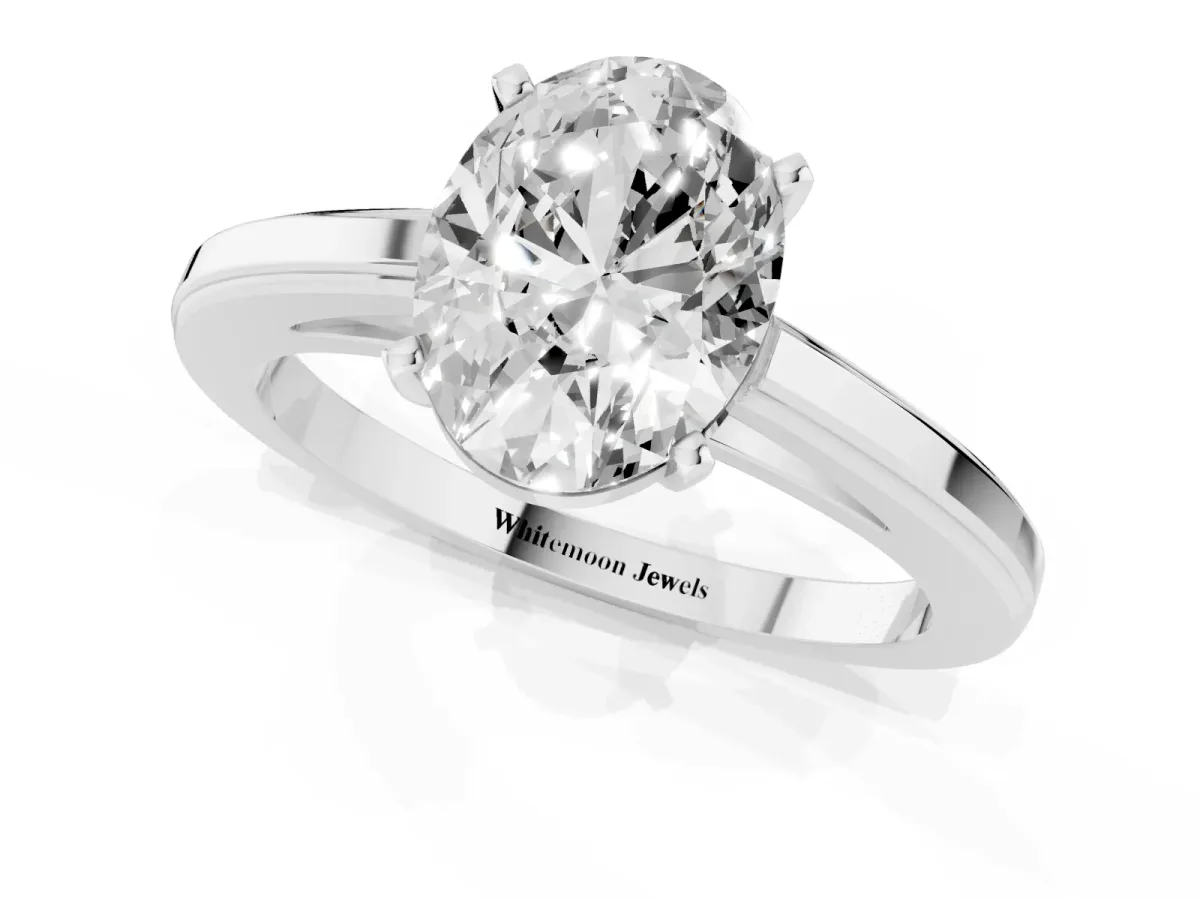 Oval Cut Solitaire Diamond Ring with Four-Prong Setting and Classic Band Silver