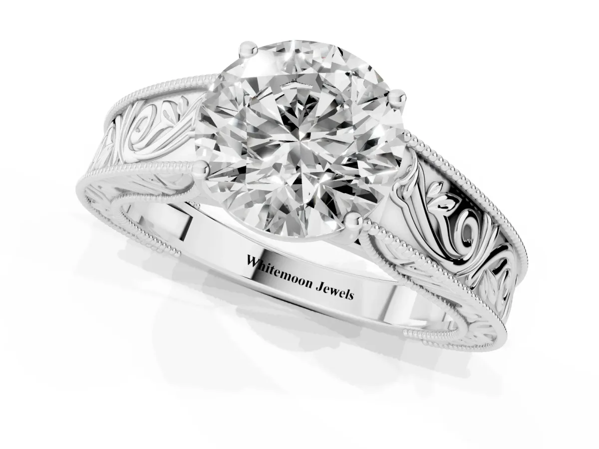 Round Cut Diamond Solitaire Ring with Engraved Band and Four-Prong Setting White gold