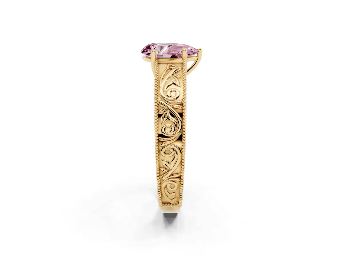 Fancy Pink Pear Cut Diamond Solitaire Ring with Engraved Band and Four-Prong Setting Yellow gold