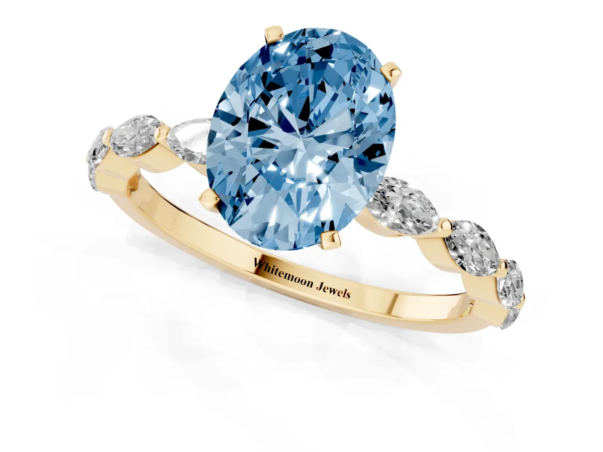 Fancy Blue Oval Cut Diamond Ring with Marquise Side Stones and Prong Setting Yellow gold