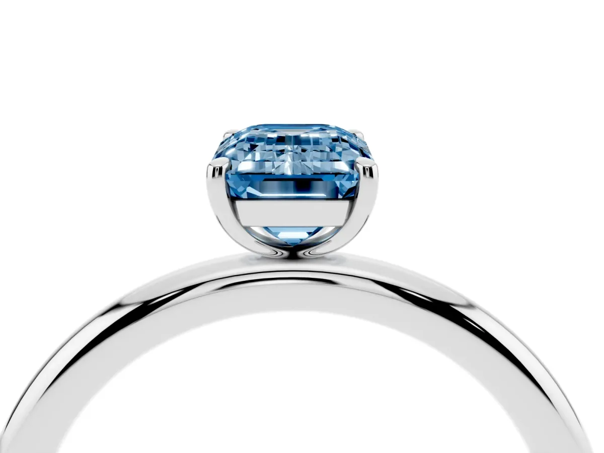 Fancy Blue Emerald Cut Solitaire Diamond Ring with Four-Prong Setting on a Plain Band White gold