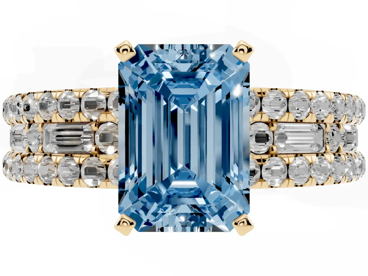 Fancy Blue Emerald Cut Diamond Solitaire Ring with Pavé and Channel Set Band Yellow gold