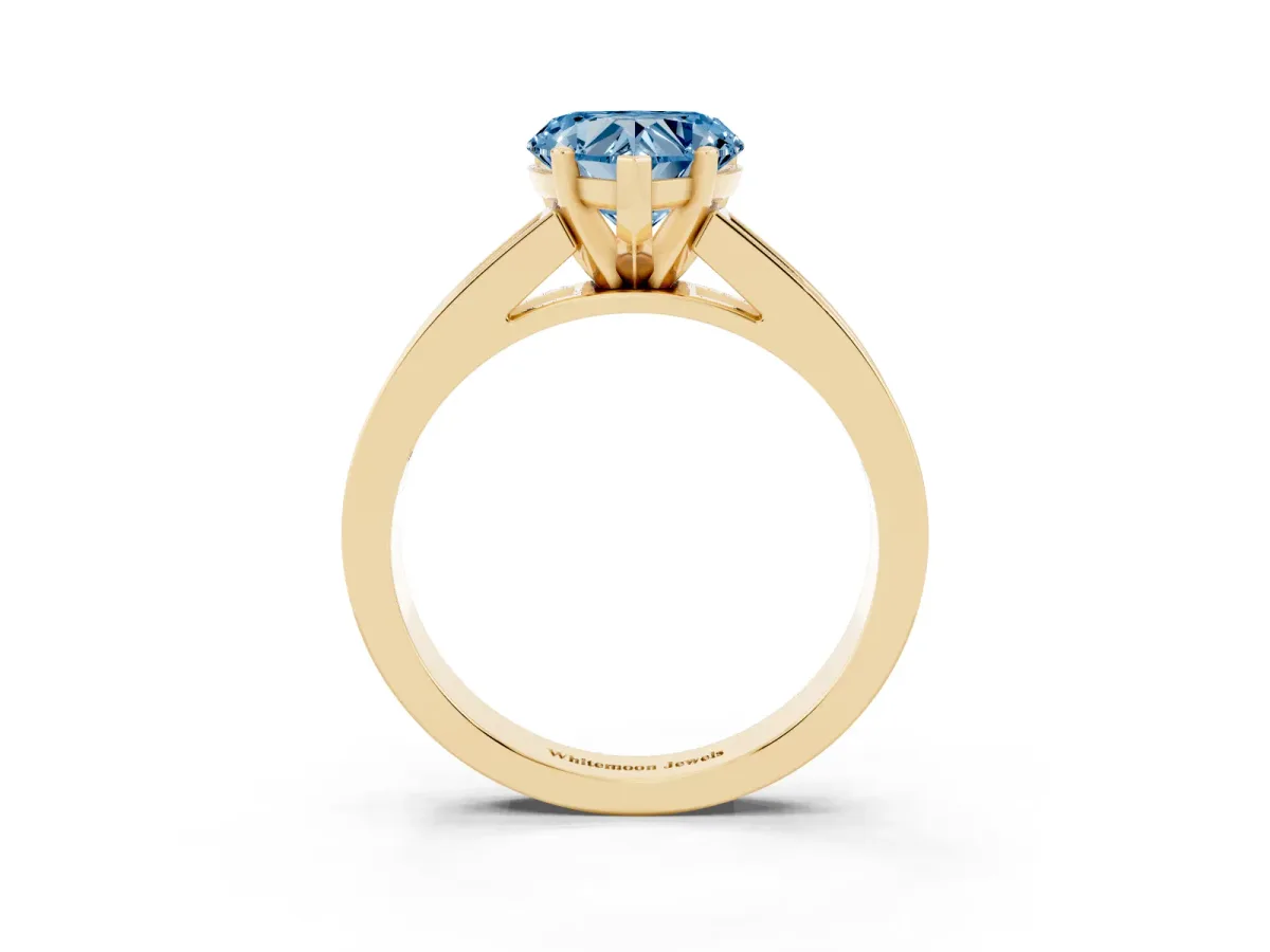 Fancy Blue Heart Cut Solitaire Diamond Ring with Channel-Set Band and Four-Prong Setting Yellow gold