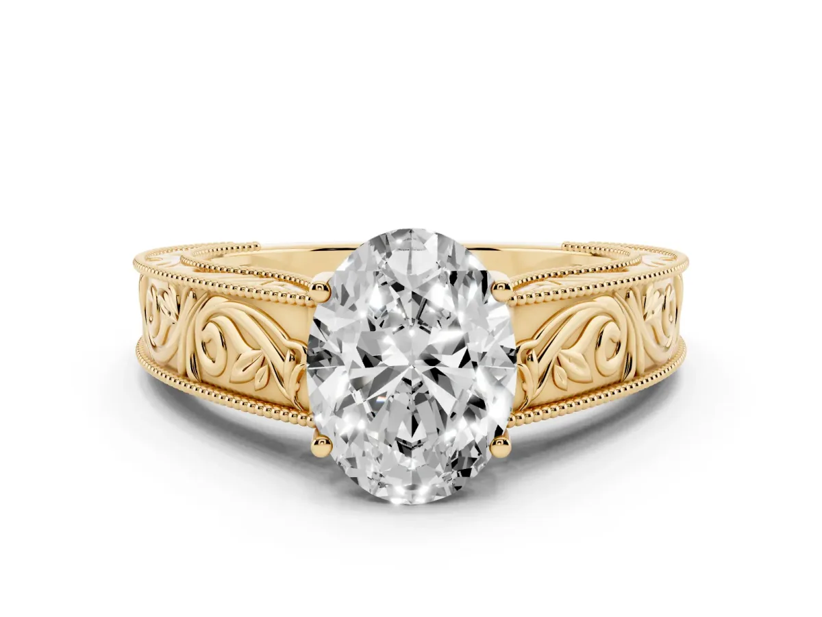 Oval Cut Diamond Solitaire Ring with Engraved Band and Four-Prong Setting Yellow gold