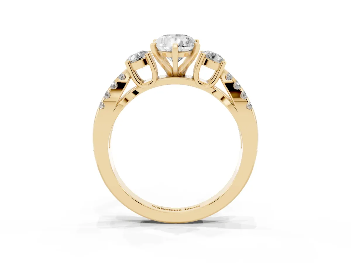 Pear Cut Diamond Three-Stone Ring with Pavé Split Shank and Four-Prong Setting Yellow gold