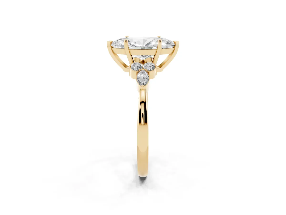 Marquise Cut Brilliant Diamond Solitaire Ring with Pear Side Stones and Four-Prong Setting Yellow gold
