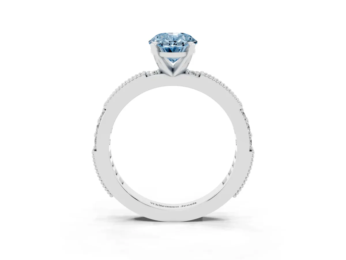 Fancy Blue Oval Cut Solitaire with Pavé Band and Four-Prong Setting Silver