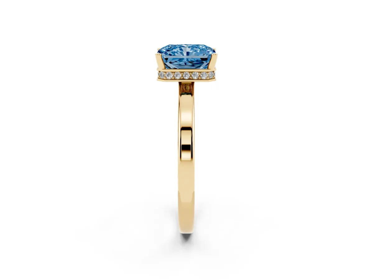 Fancy Blue Radiant Cut Cut Solitaire Engagement Ring with Four-Prong Setting on a Classic Band Yellow gold