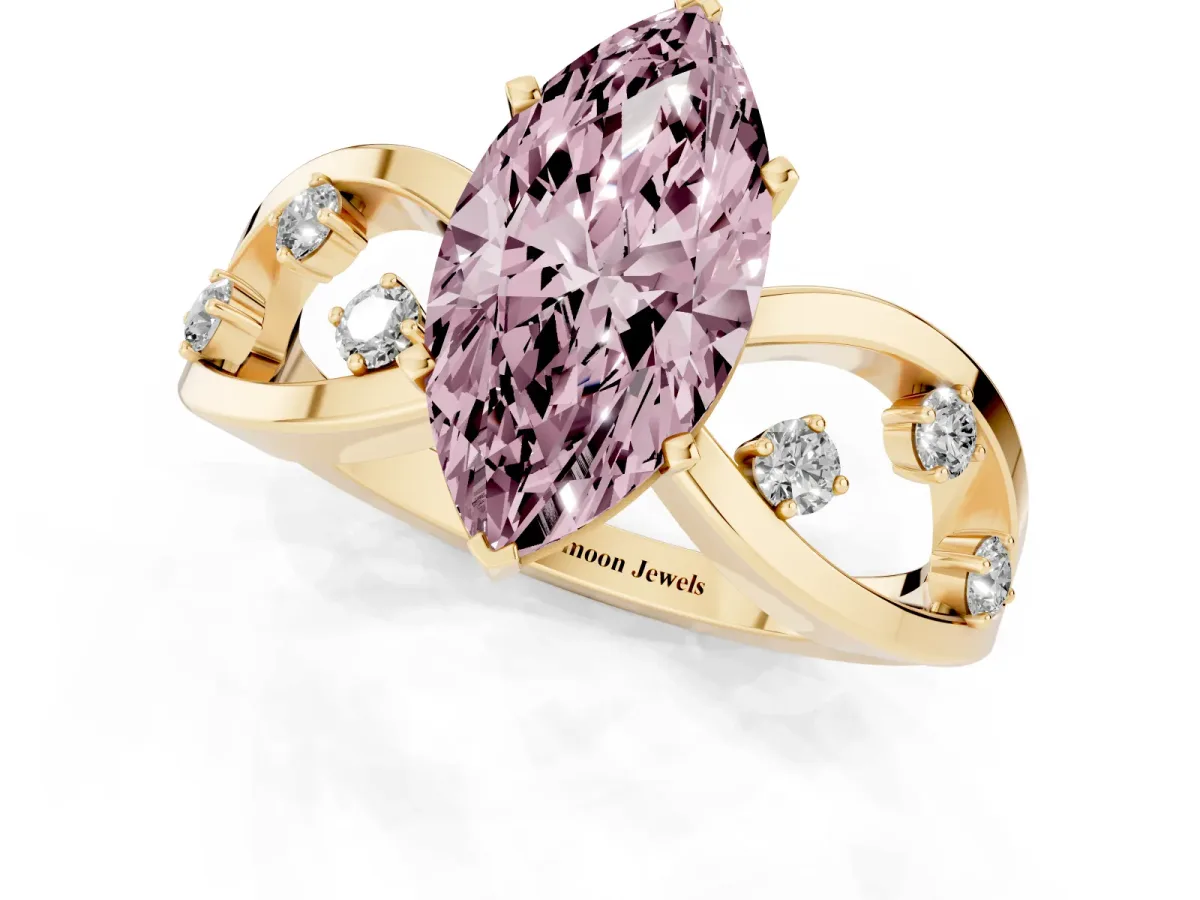 Fancy Pink Marquise Cut Cut Solitaire Diamond with Side Stones on Criss-Cross Band and Four-Prong Setting Yellow gold