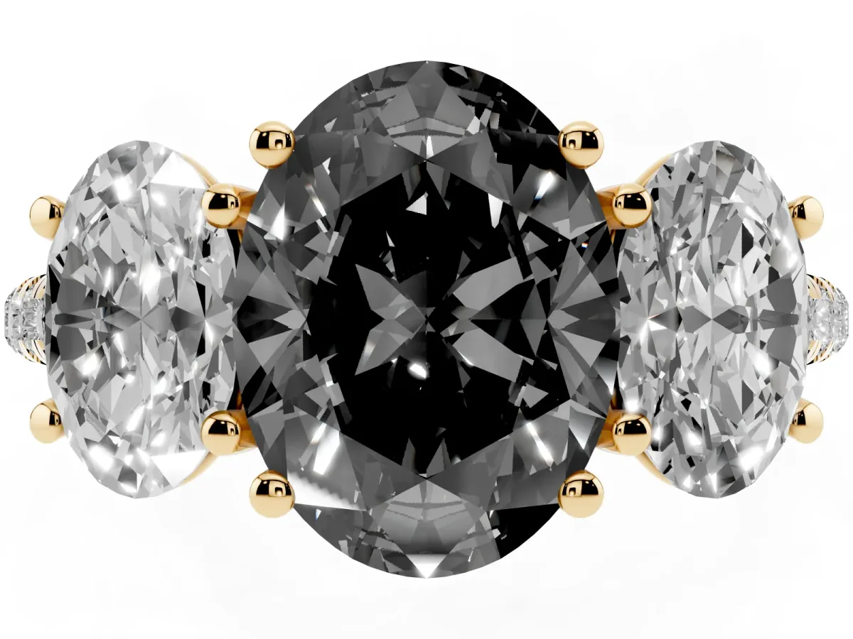 Fancy Black Three-Stone Oval Cut Diamond Ring with Round Pavé Band and Prong Setting Yellow gold