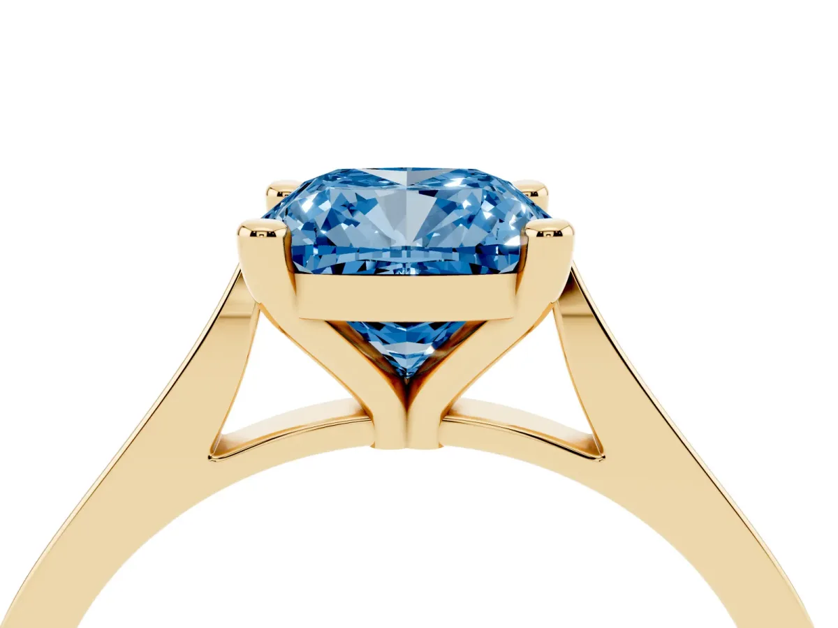 Fancy Blue Cushion Cut Solitaire Diamond Ring with Four-Prong Setting and Tapered Band Yellow gold