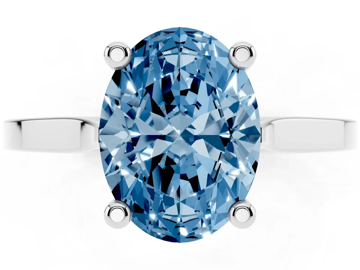 Fancy Blue Oval Cut Solitaire Diamond Ring with Four-Prong Setting and Tapered Band Platinum