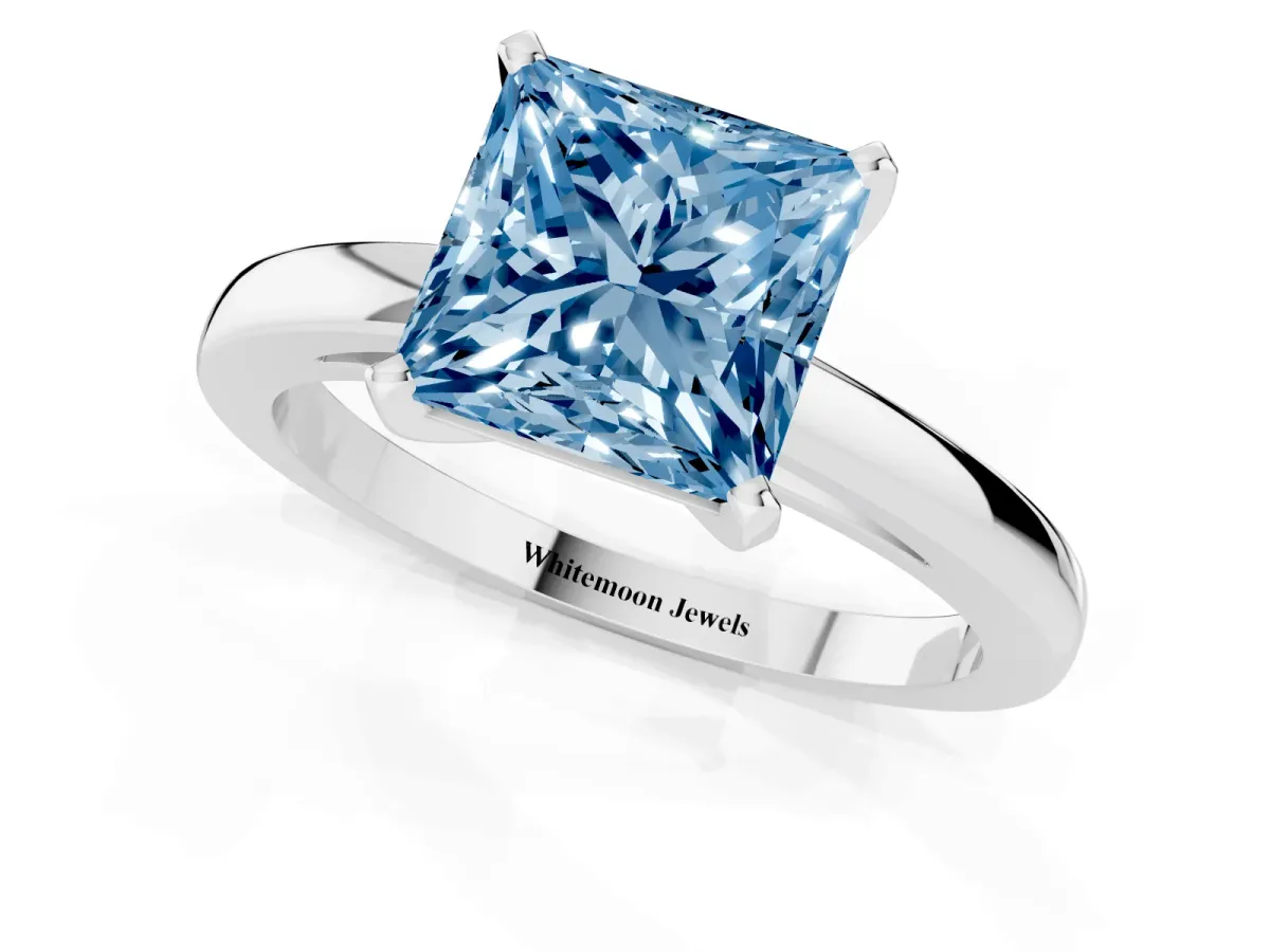 Fancy Blue Princess Cut Solitaire Diamond Engagement Ring with Four-Prong Setting on a Classic Band Silver