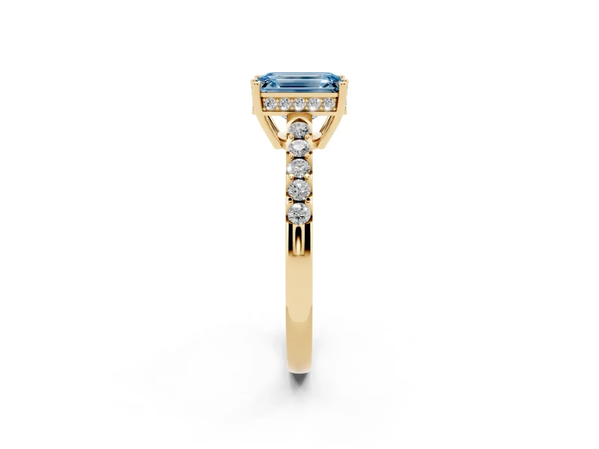 Fancy Blue Emerald Cut Solitaire Diamond Engagement Ring with Pavé Band and Six-Prong Setting Yellow gold