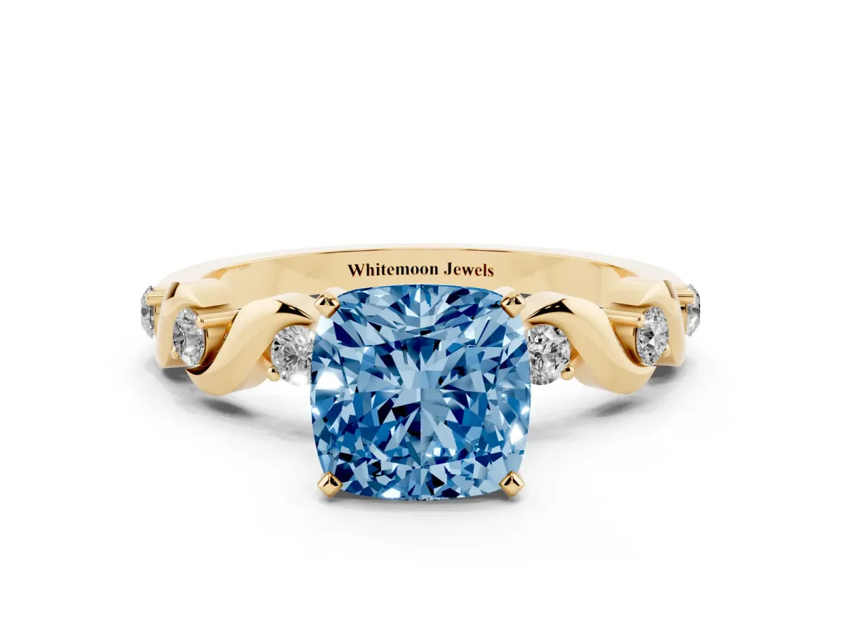 Fancy Blue Cushion Cut Diamond Solitaire Twisted Band with Round Accents and Prong Setting Yellow gold