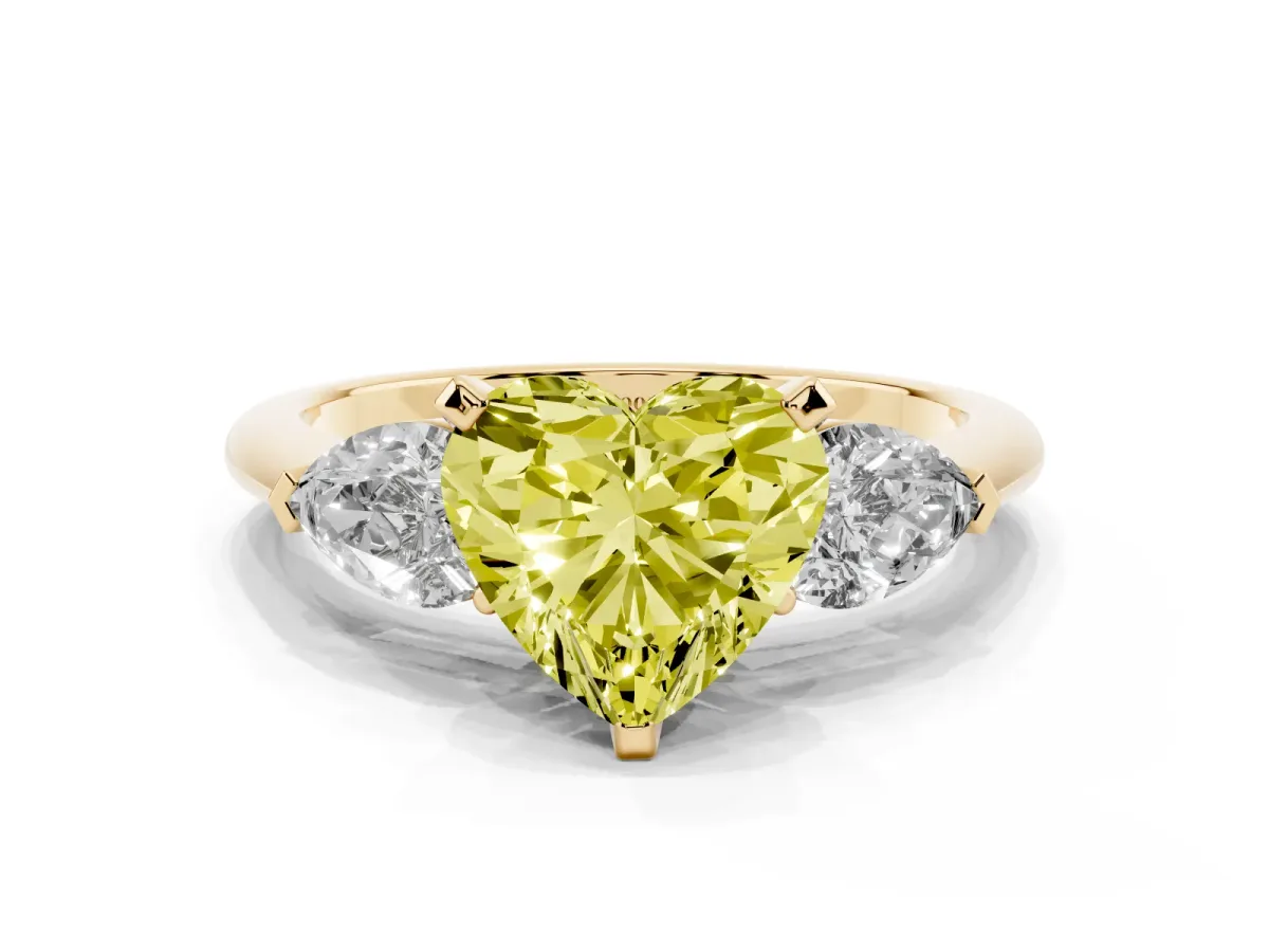 Fancy Yellow Three-Stone Heart Cut Diamond Ring with Pear Side Stones and Four-Prong Setting Yellow gold