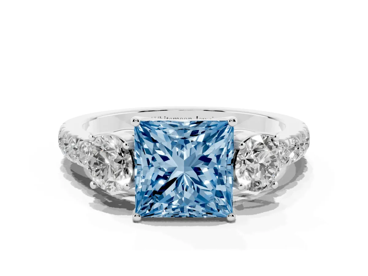 Fancy Blue Princess Cut Cut Diamond Three-Stone Ring with Round Side Stones and Pavé Band Platinum