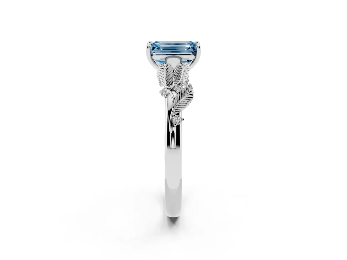 Fancy Blue Emerald Cut Diamond Solitaire Ring with Leaf Motif Band and Four-Prong Setting Silver