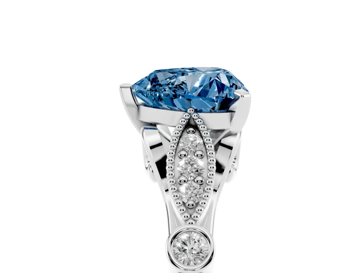 Fancy Blue Heart Cut Cut Diamond with Milgrain Marquise and Bezel Accents on a Solitaire Band with Prong Setting Platinum