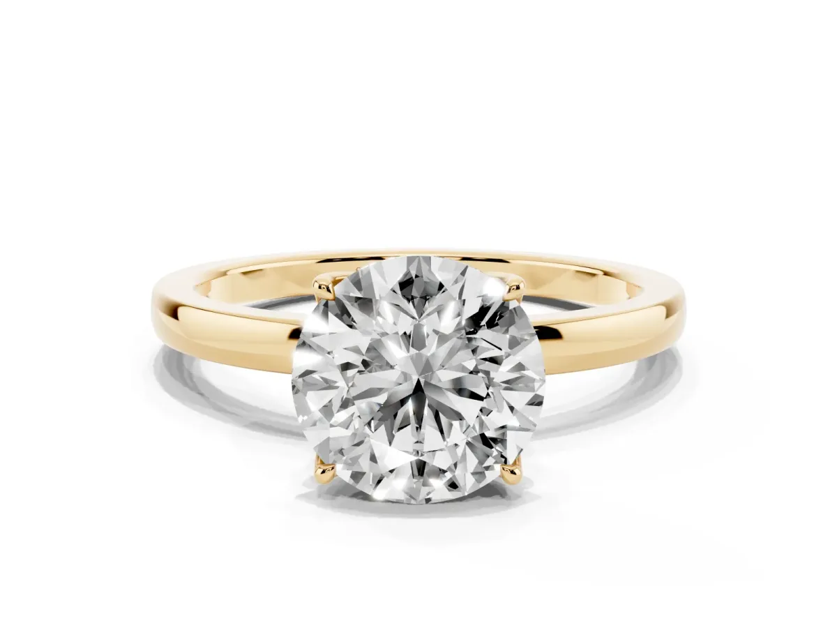 Round Cut Diamond Solitaire Ring with Thin Band and Prong Setting Yellow gold