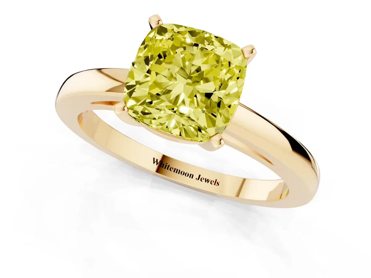 Fancy Yellow Cushion Cut Solitaire Diamond Engagement Ring with Four-Prong Setting on a Classic Band Yellow gold