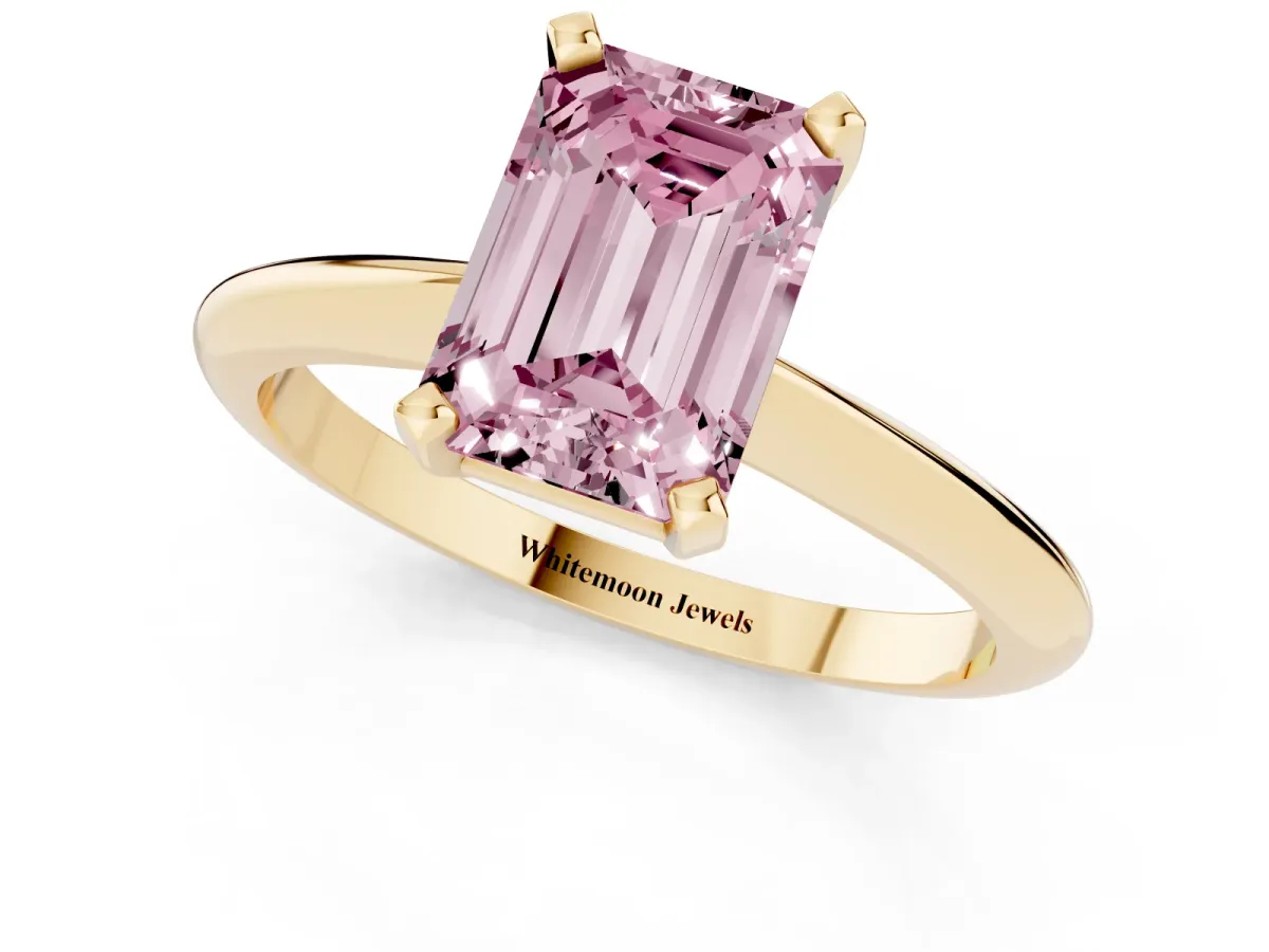 Fancy Pink Emerald Cut Cut Solitaire Ring with Four-Prong Setting on a Classic Band Yellow gold