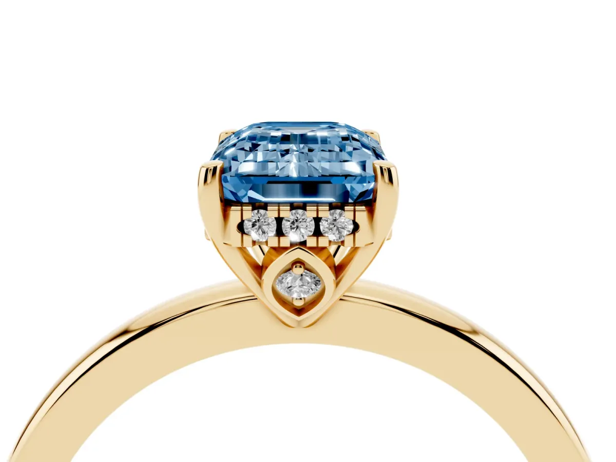 Fancy Blue Emerald Cut Solitaire Diamond Ring with Prong Setting and Plain Band Yellow gold