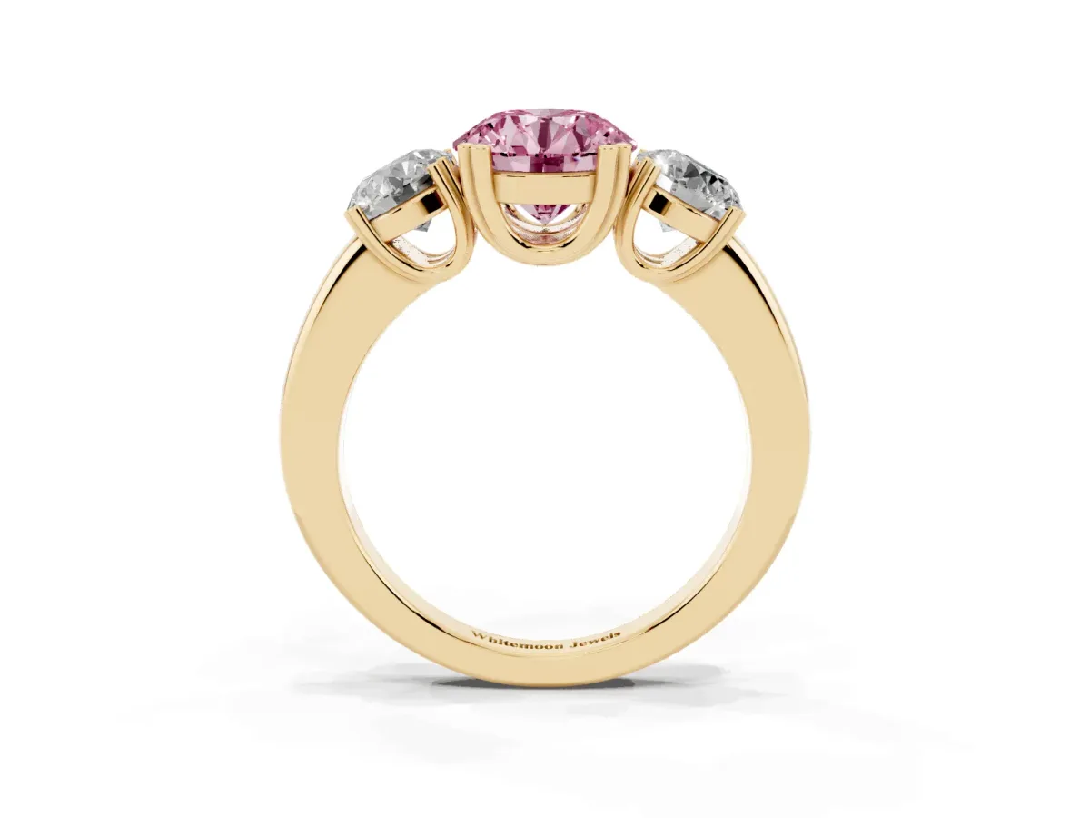 Fancy Pink Three-Stone Round Cut Cut Diamond Ring with Channel Set Band and Four-Prong Setting Yellow gold