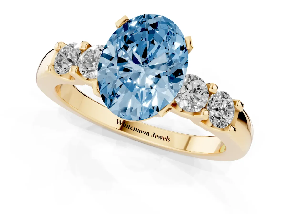 Fancy Blue Oval Cut Brilliant Cut Diamond Five-Stone Prong Set Engagement Ring with Channel Band Yellow gold