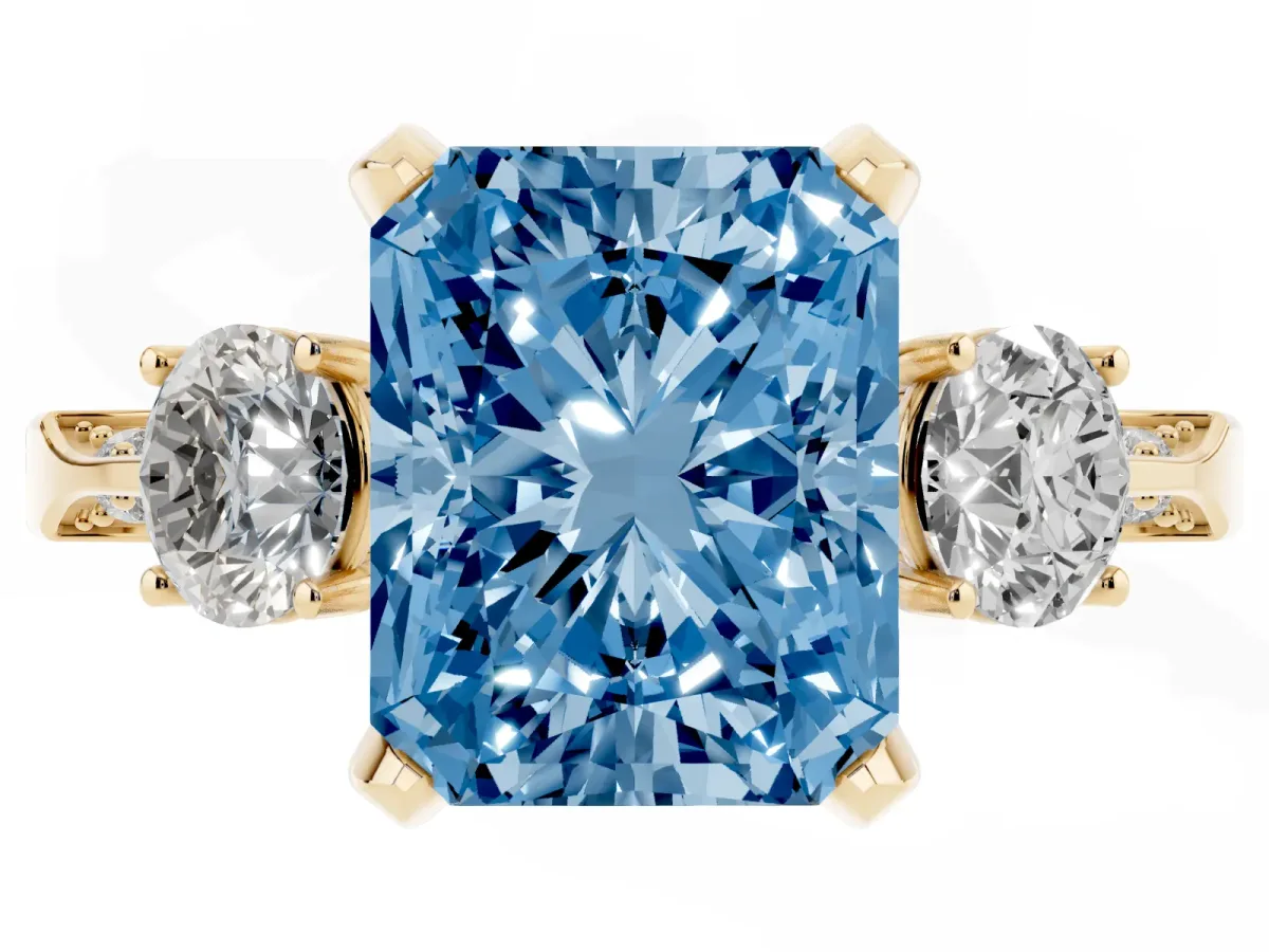 Fancy Blue Radiant Cut Brilliant Three-Stone Diamond Ring with Pavé Band and Four-Prong Setting Yellow gold