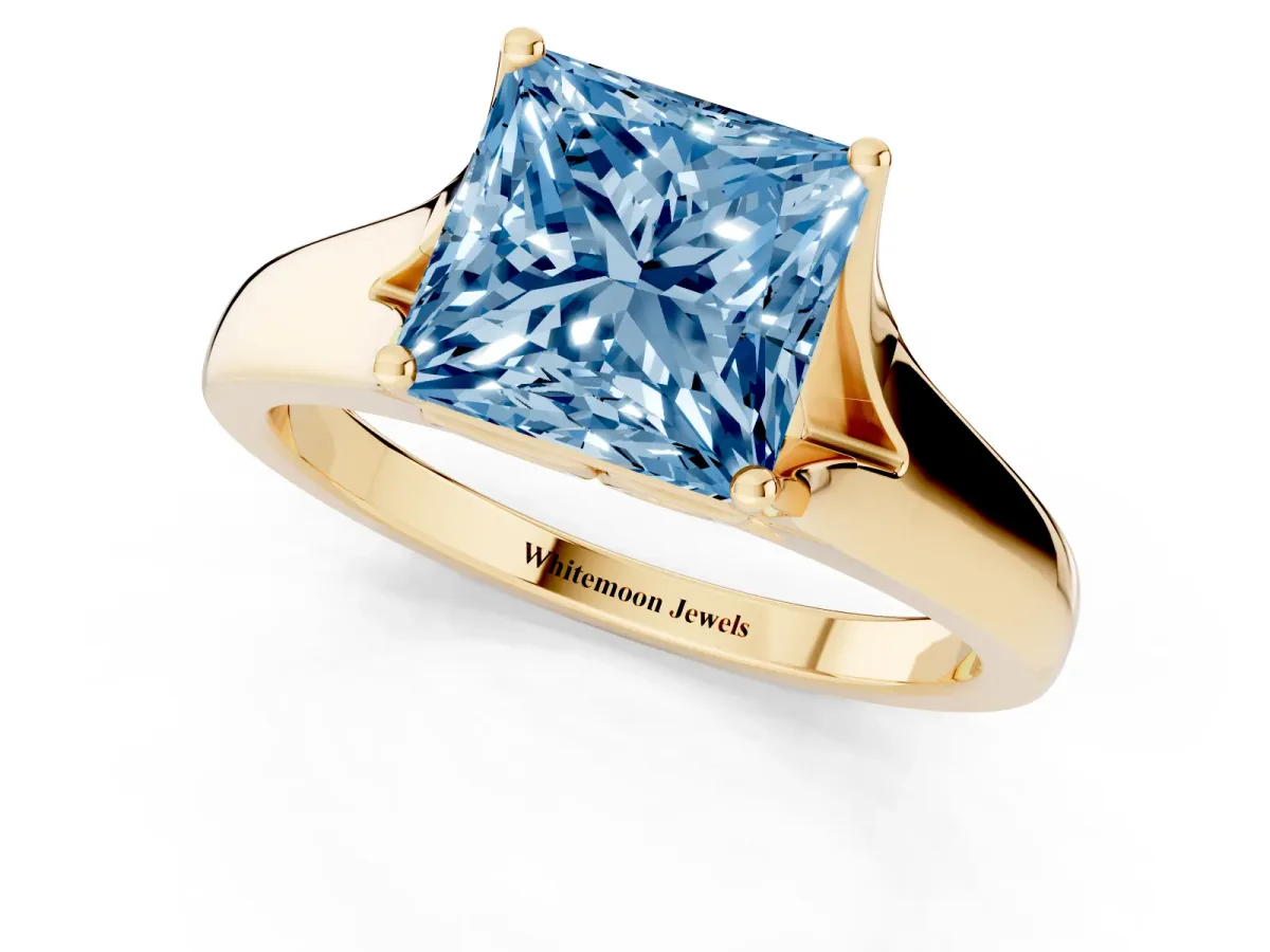 Fancy Blue Princess Cut Solitaire Diamond Ring with Cathedral Band and Four-Prong Setting Yellow gold