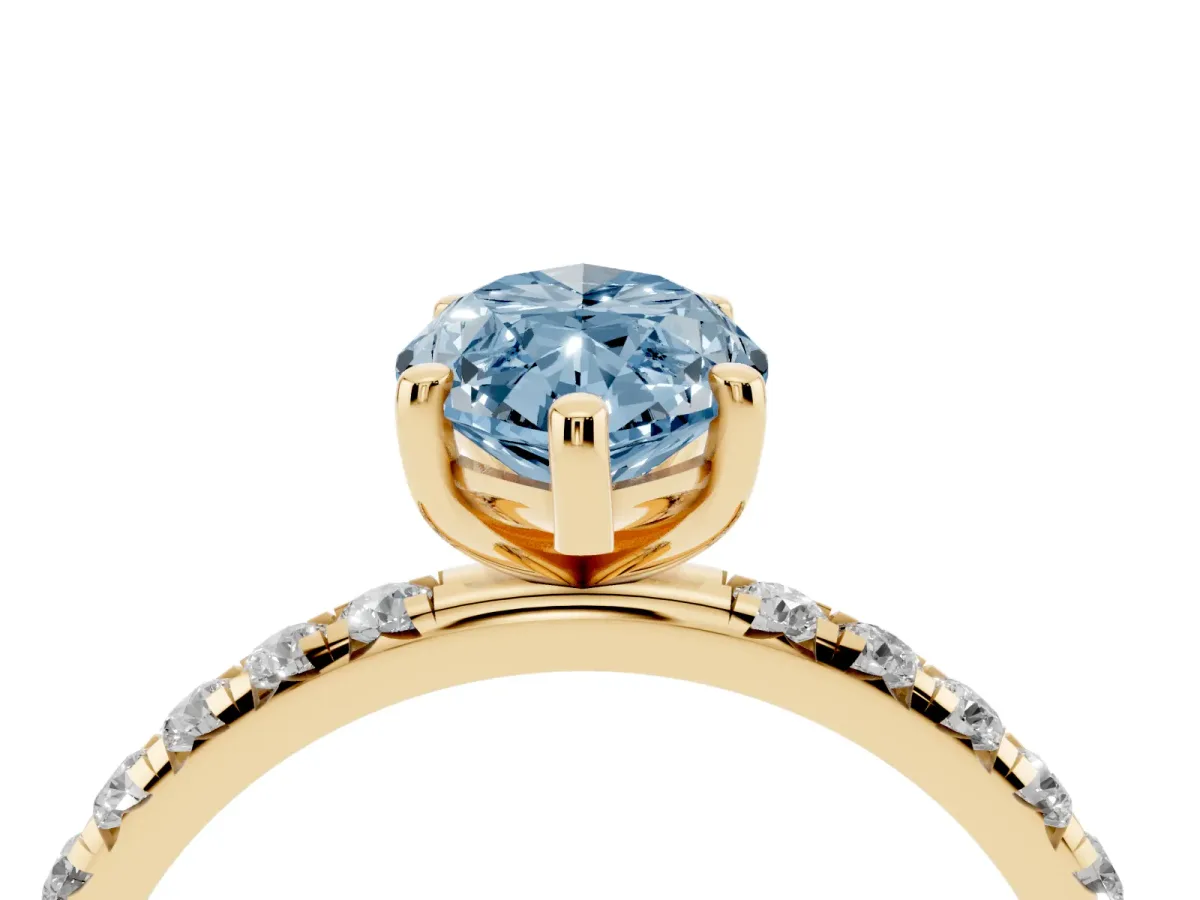 Fancy Blue Marquise Cut Cut Diamond Solitaire Ring with Micro Pave Band and Four Prong Setting Yellow gold