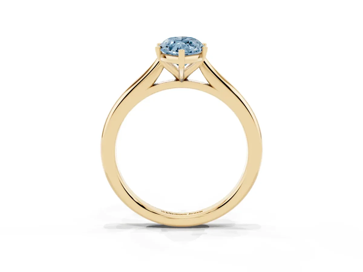 Fancy Blue Marquise Cut Cut Solitaire Ring with Cathedral Band and Four-Prong Setting Yellow gold