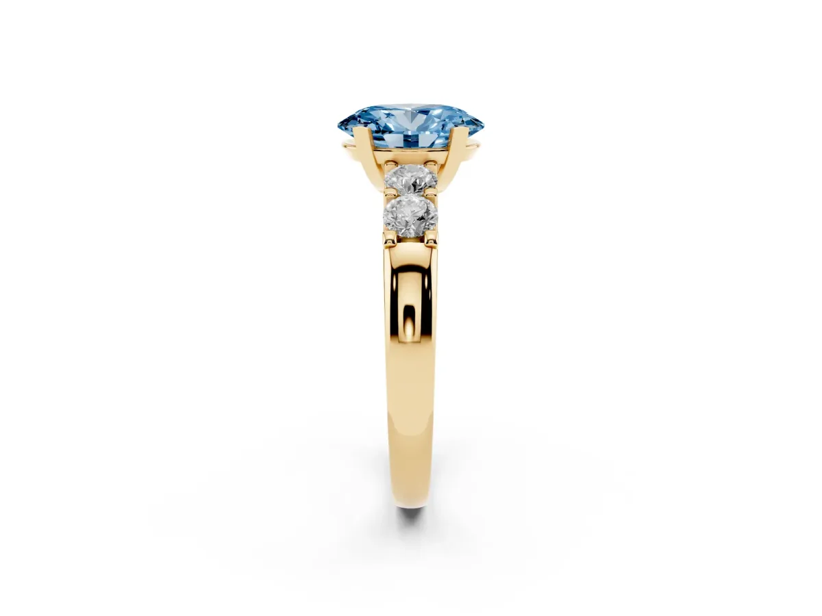 Fancy Blue Oval Cut Brilliant Cut Diamond Five-Stone Prong Set Engagement Ring with Channel Band Yellow gold