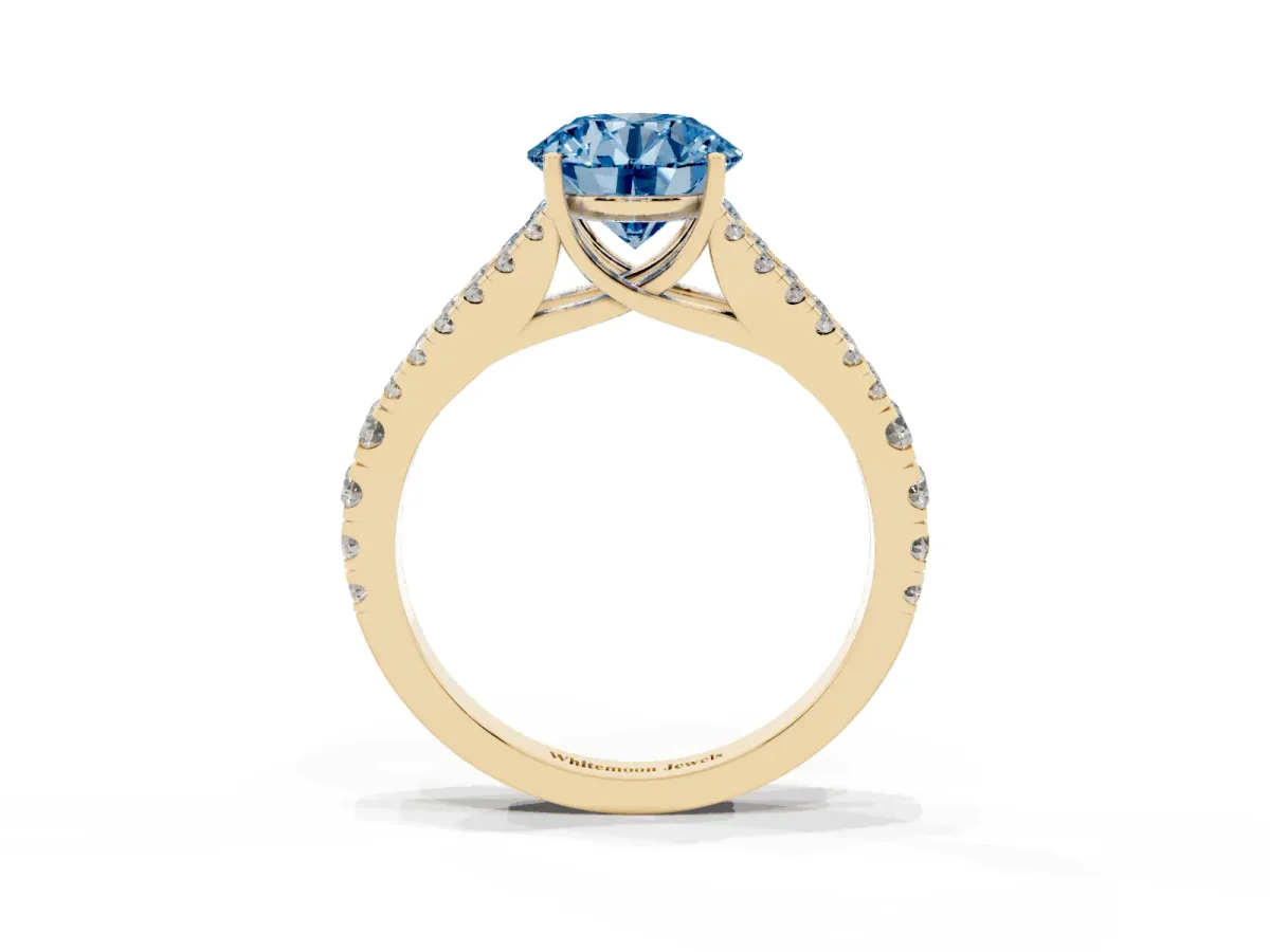Fancy Blue Round Cut Diamond Split Shank Engagement Ring with Round Pavé and Prong Setting Yellow gold
