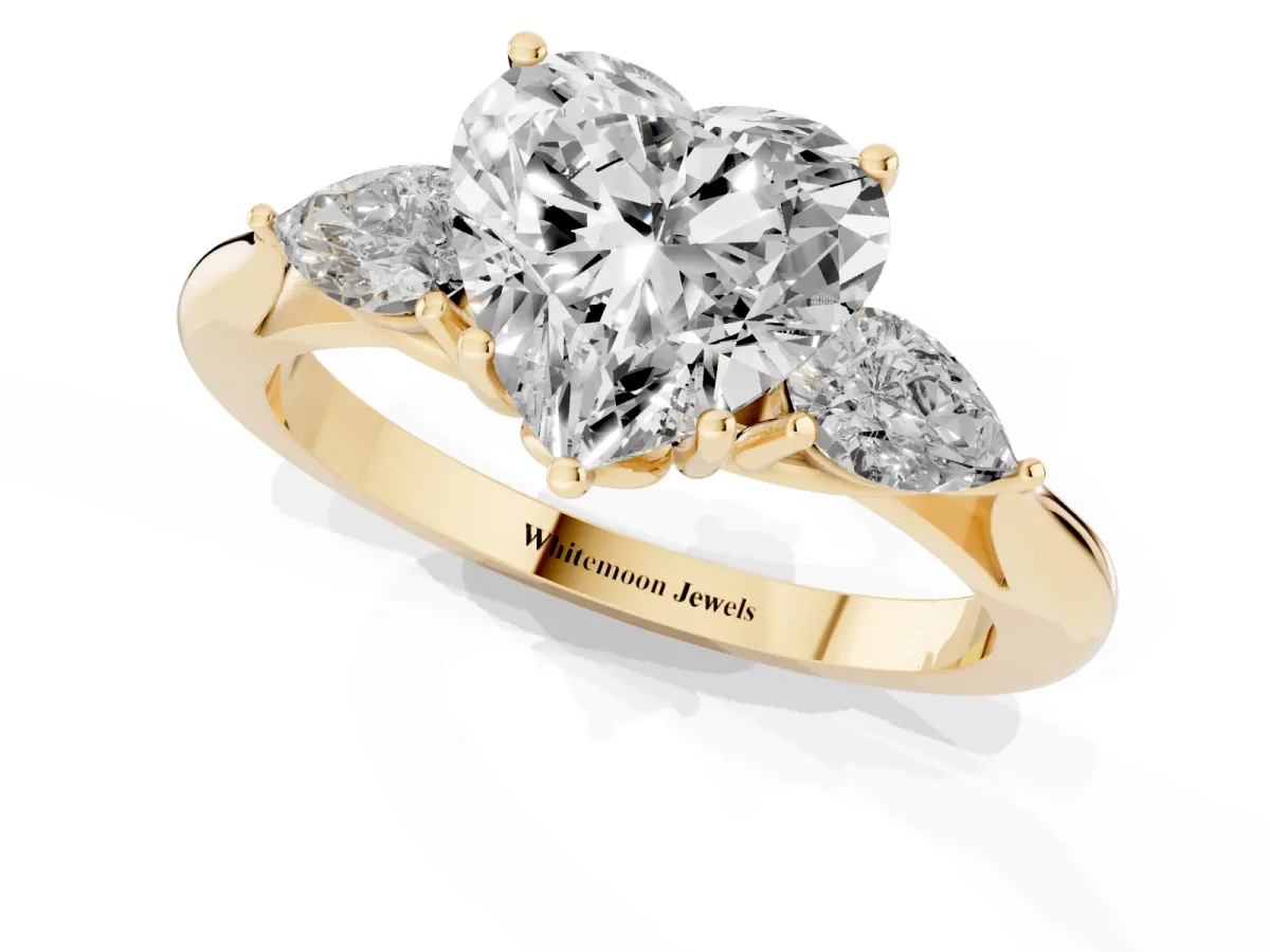 Heart Cut Diamond Three-Stone Ring with Pear Side Stones and Prong Setting Yellow gold
