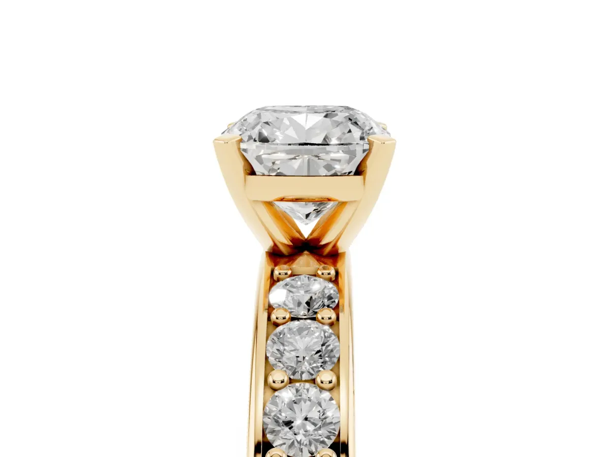 Cushion Cut Diamond Engagement Ring with Channel Set Round Band and Prong Setting Yellow gold