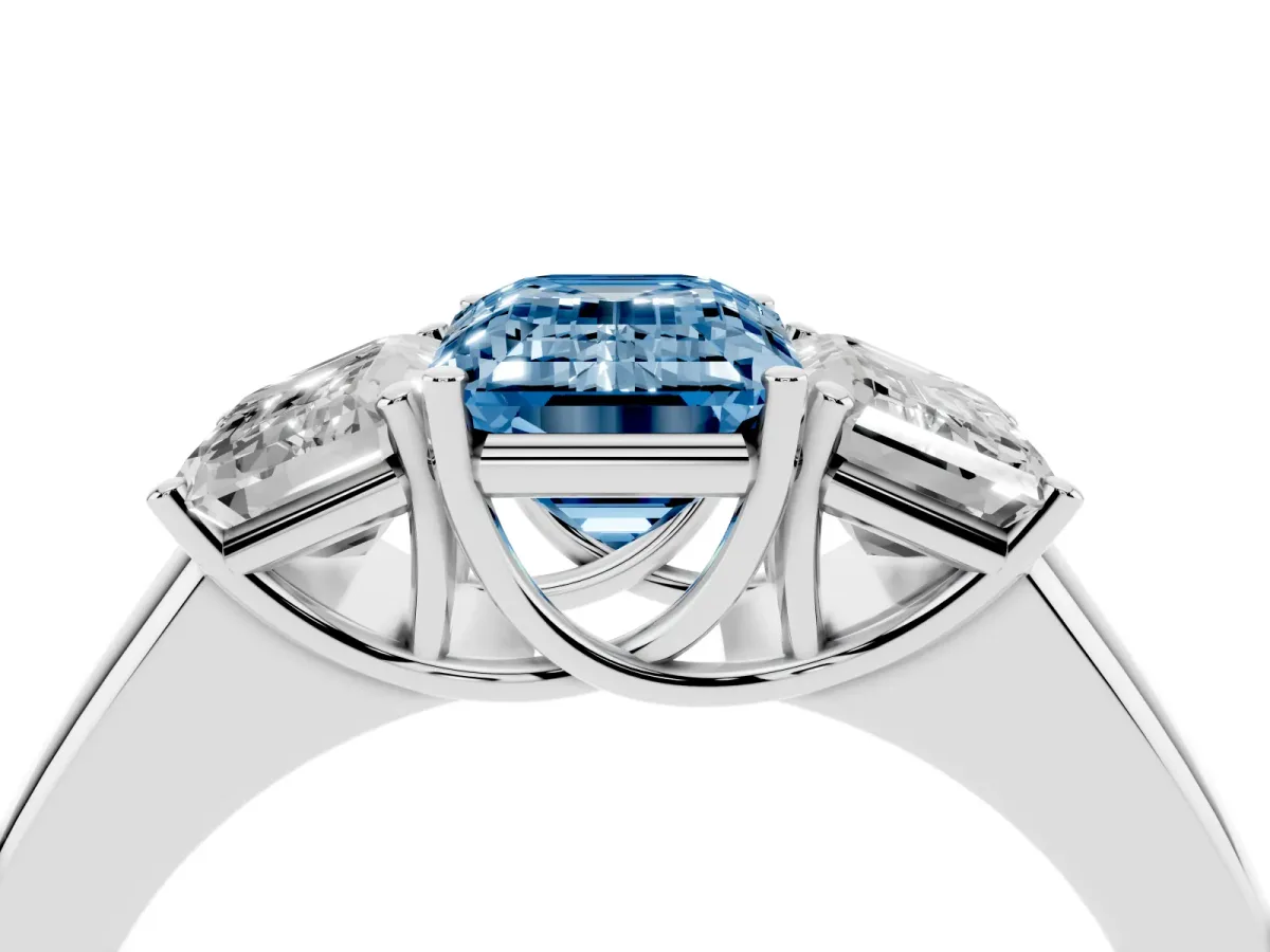 Fancy Blue Three-Stone Emerald Cut Cut Diamond Ring with Prong Setting and Classic Band Silver