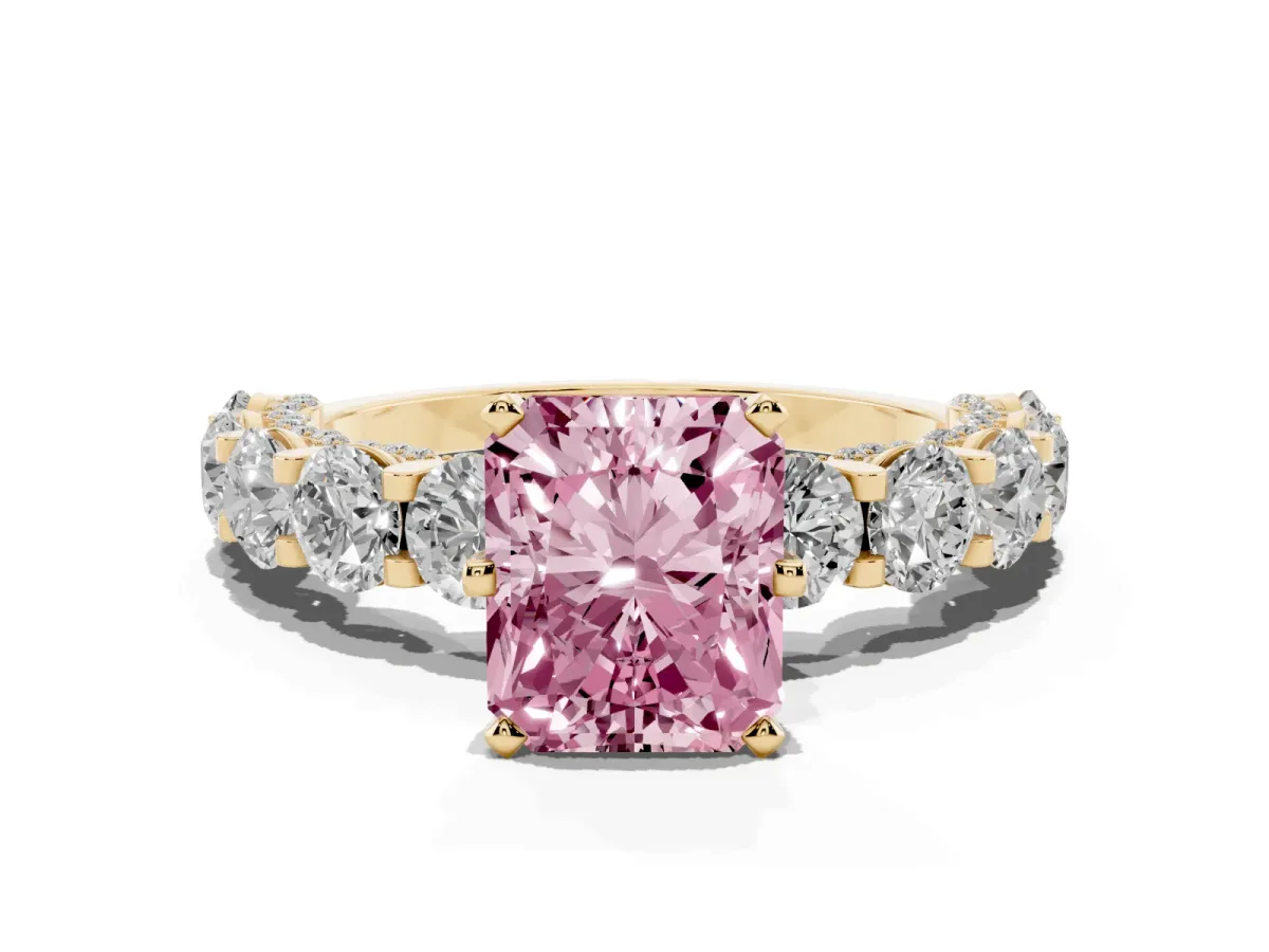 Fancy Pink Radiant Cut Diamond Side Stone Engagement Ring with Four-Prong Setting Yellow gold