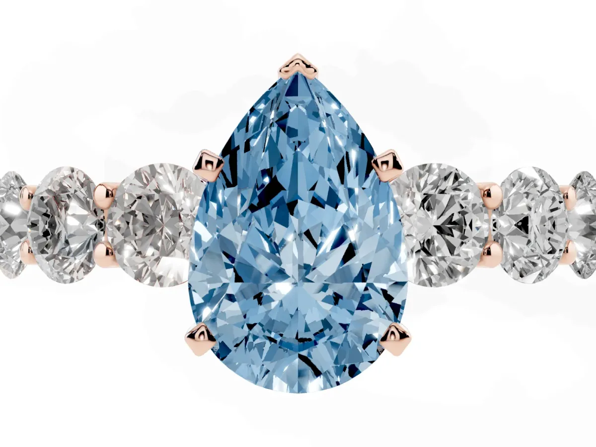 Fancy Blue Pear Cut Diamond Prong Setting with Side Stones on a Pave Band Rose gold