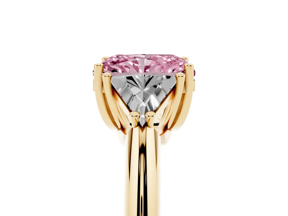 Fancy Pink Three-Stone Radiant Cut Diamond Engagement Ring with Trillion Side Stones and Prong Setting Yellow gold