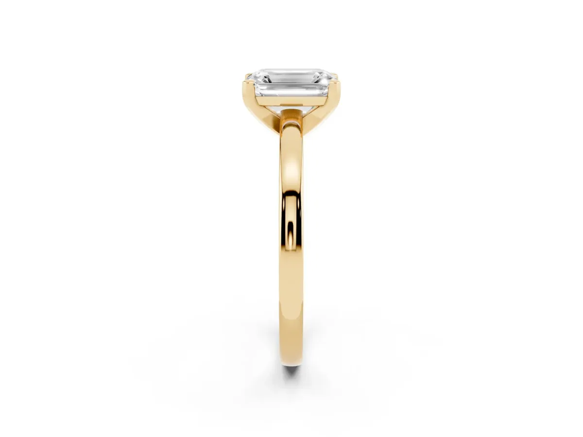 Emerald Cut Solitaire Diamond Engagement Ring with Four-Prong Setting on a Classic Band Yellow gold
