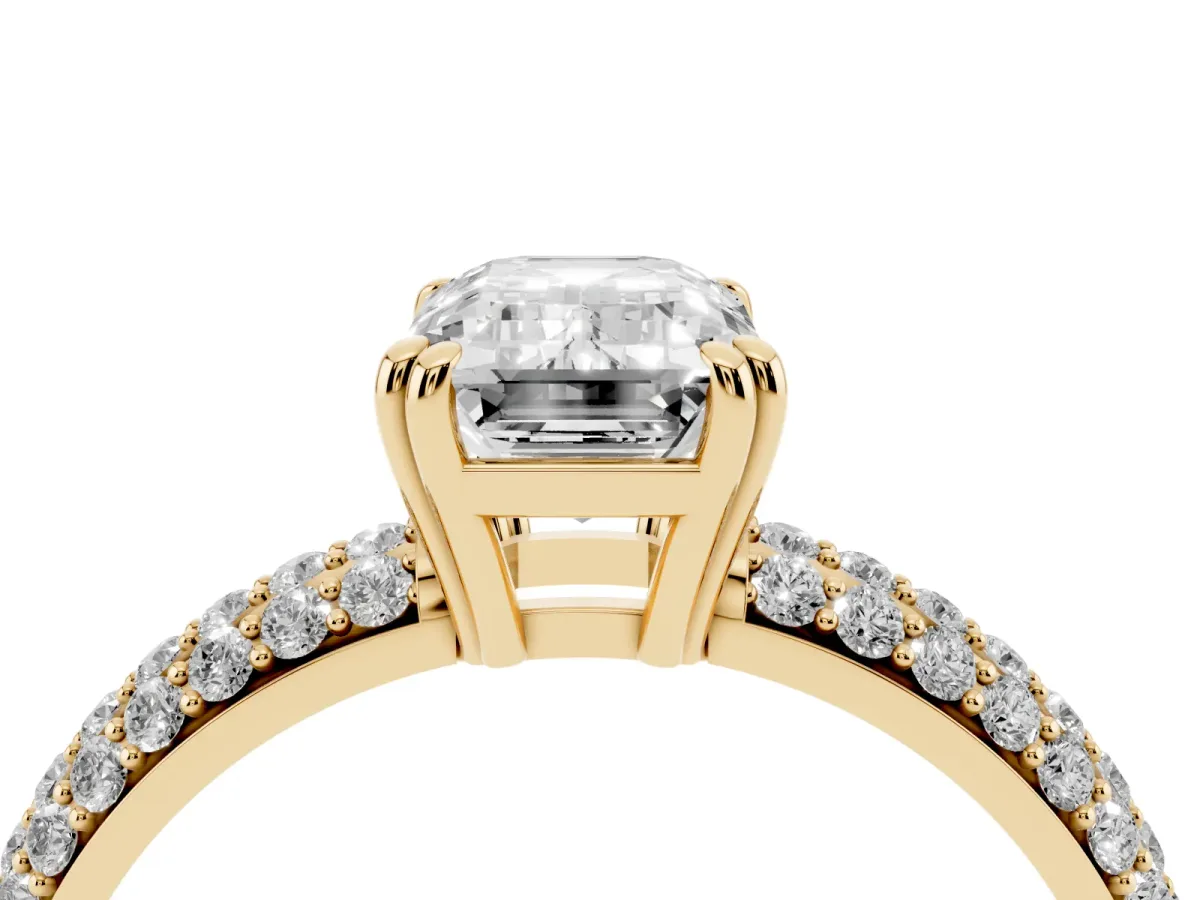 Emerald Cut Diamond Solitaire Ring with Multi-Row Round Pavé Band and Prong Setting Yellow gold