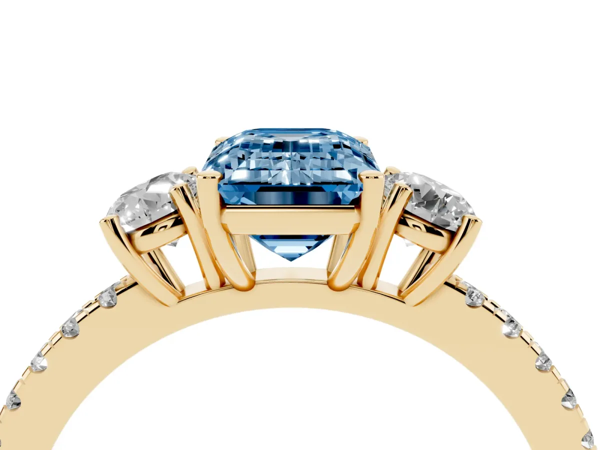 Fancy Blue Three-Stone Emerald Cut Cut Diamond Pavé Band with Prong Setting Yellow gold