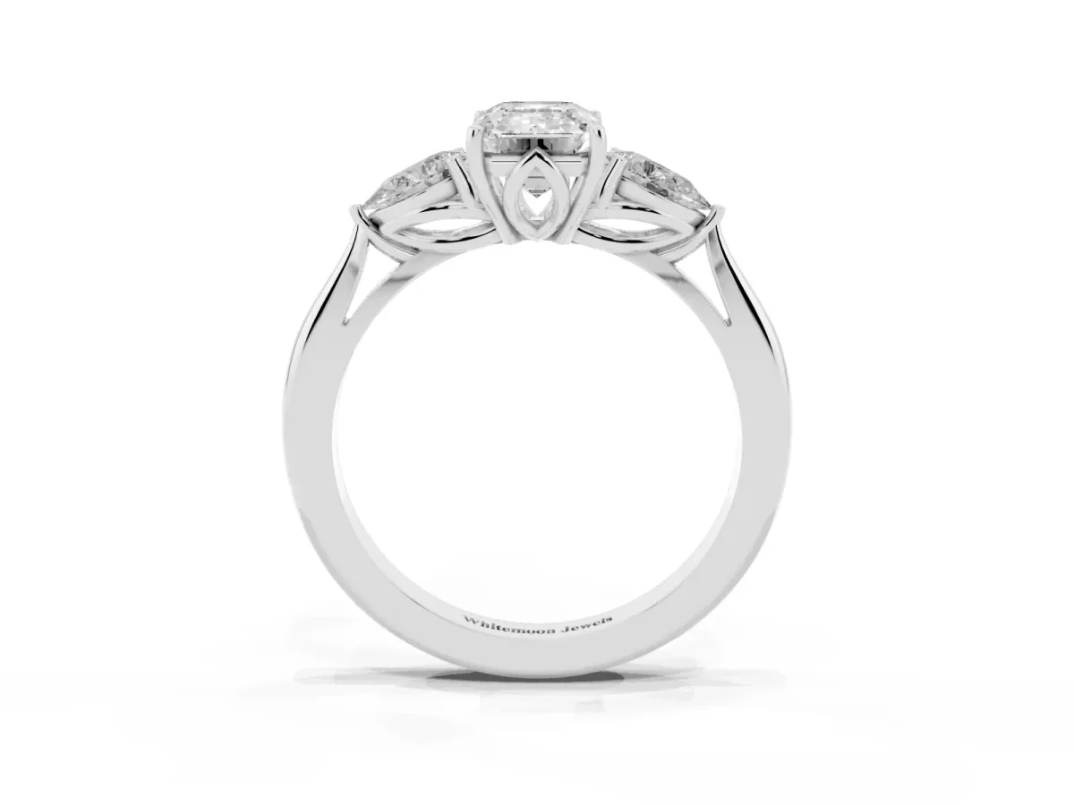 Three-Stone Emerald Cut Diamond Ring with Pear Side Stones in Four-Prong Setting Platinum