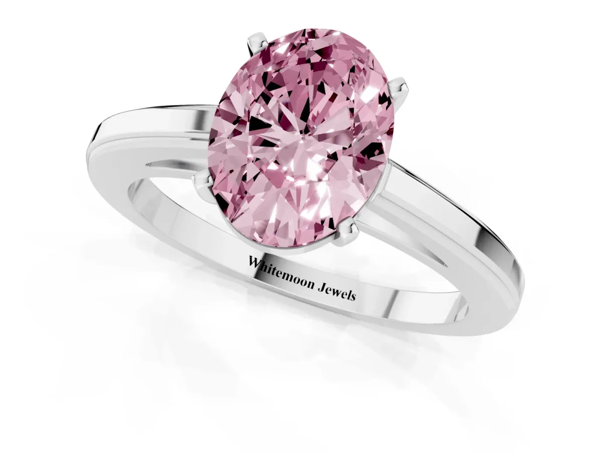 Fancy Pink Oval Cut Solitaire Diamond Ring with Four-Prong Setting and Classic Band Platinum